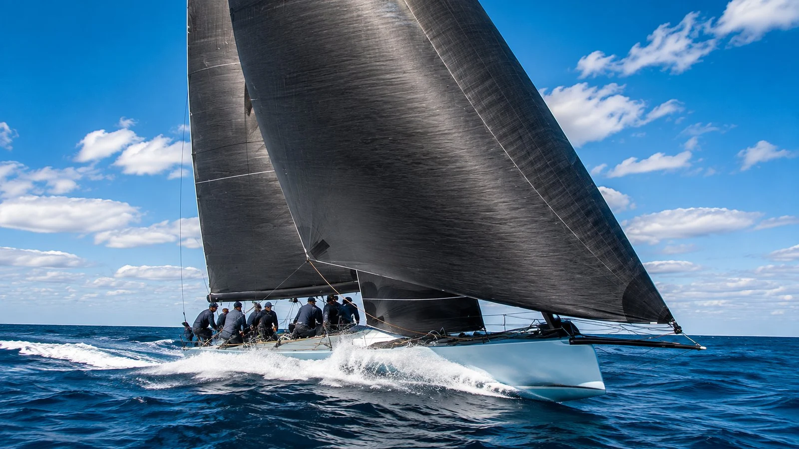 A performance cruising yacht sailing under dark Code Zero sails