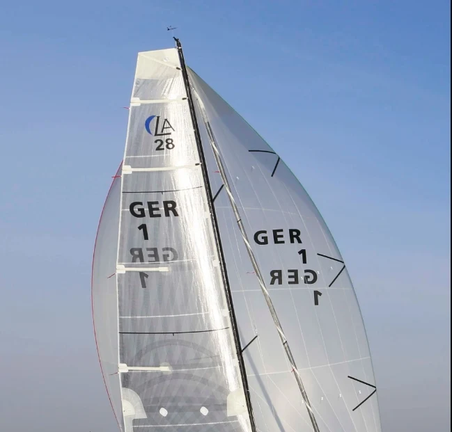 Class insignia positioned above a mainsail number
